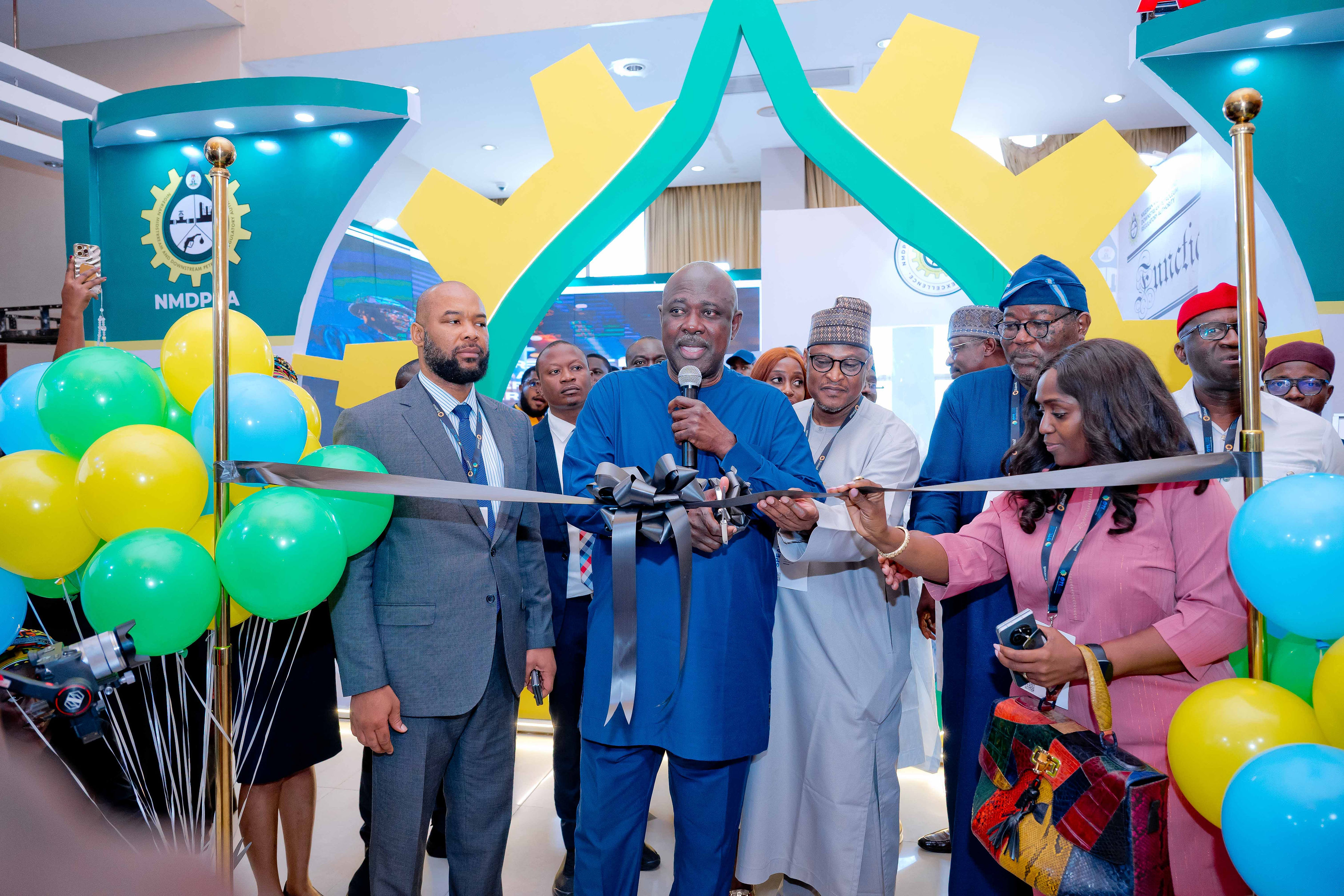 Ribbon-cutting ceremony at an exhibition stand during OTL Africa
